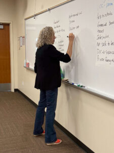 Amanda DuBois writing on whiteboard